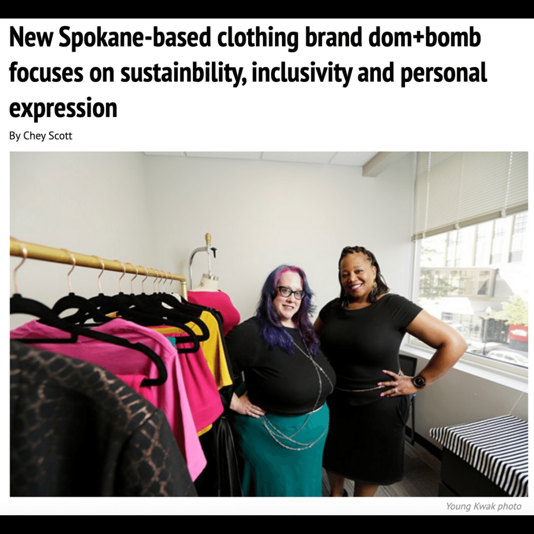 New Spokane-based clothing brand dom+bomb focuses on sustainability, inclusivity, and personal expression. Picture of Kim and Delena in their showroom next to a rack of clothing they designed. By Chey Scott. Photo by Young Kwak.