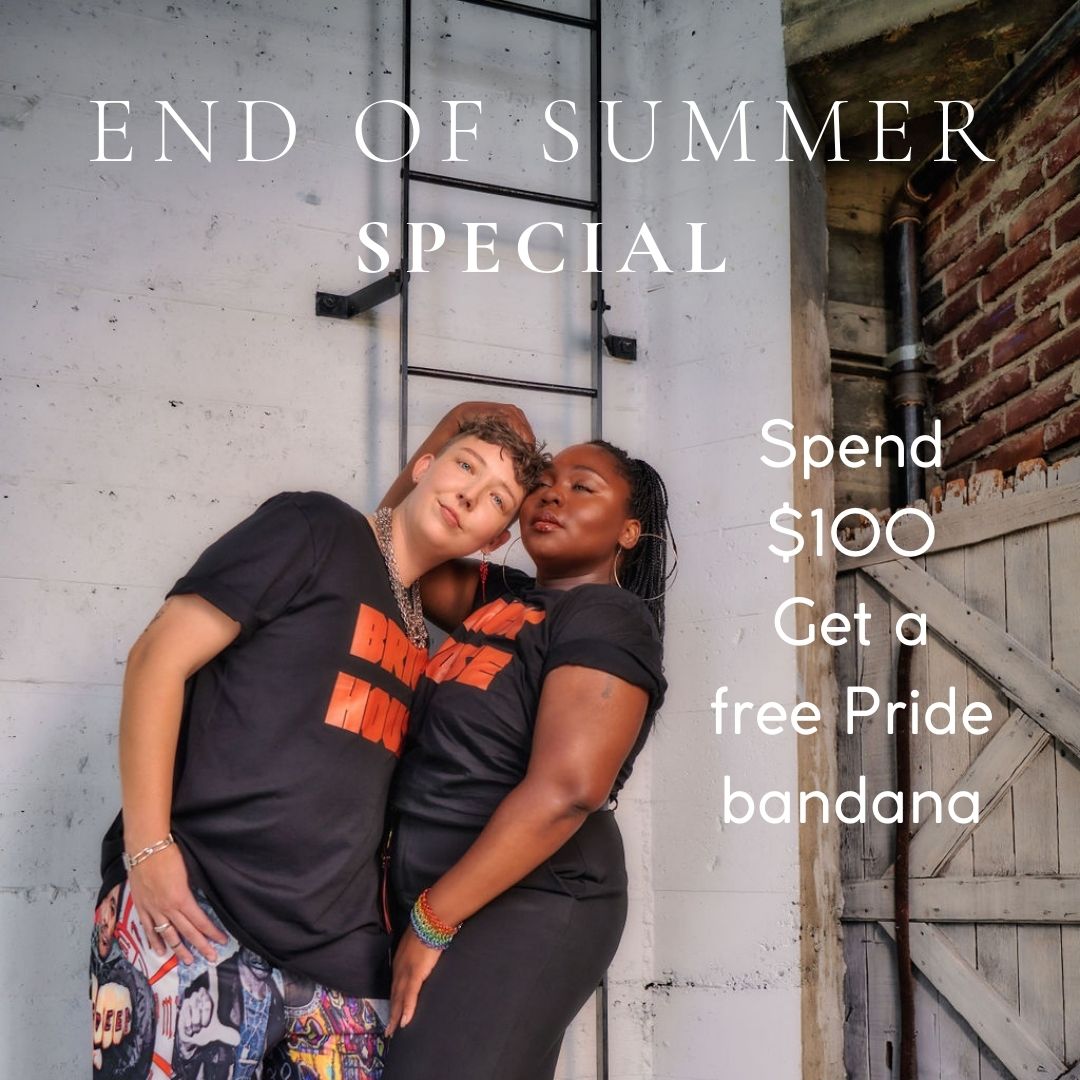 Two models stand in an embrace. Both wear our Brick House graphic tees. One looks at the camera while the other looks into the distance. White text reads End of Summer Special. Spend $100 get a free Pride bandana.